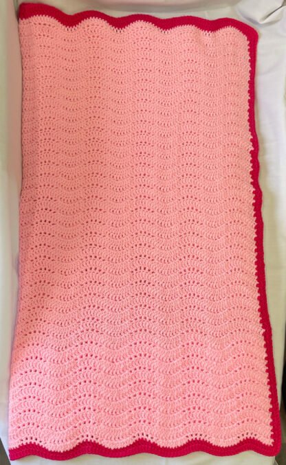 Pink-Raspberry-Feather-and-Fan-Crochet-Blanket-folded-In-half-flat-scaled